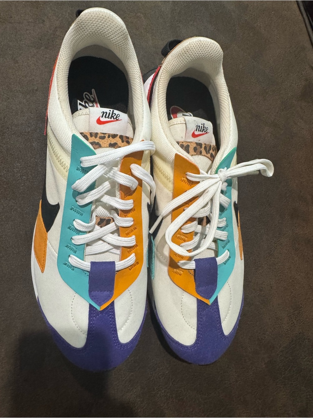 Nike White Sneakers with Teal, Orange & Purple Accents